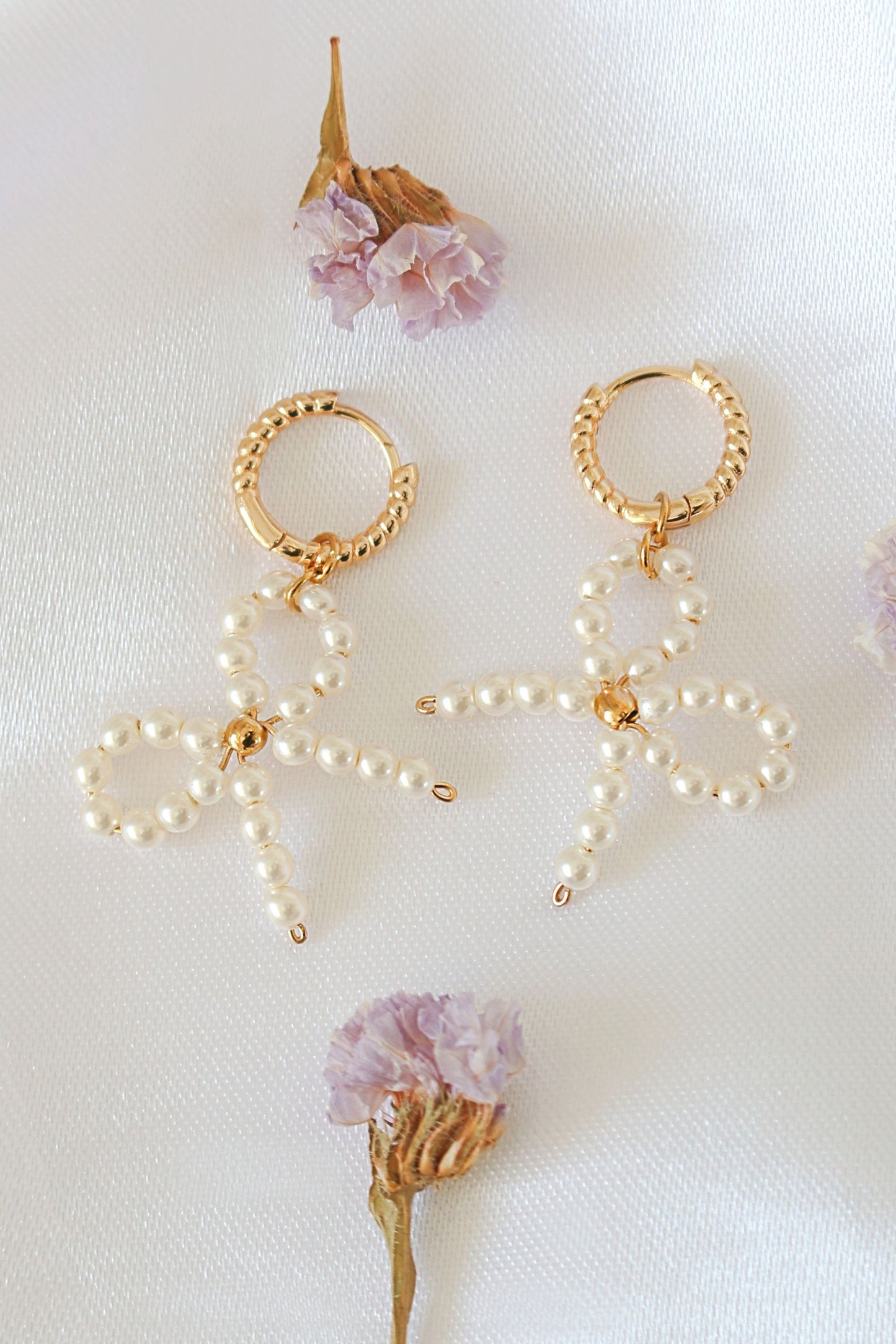 Coquette Bow Earrings Pearlized Glass & 24K Gold-Plated Hoops - The perfect flirtatious finish.
